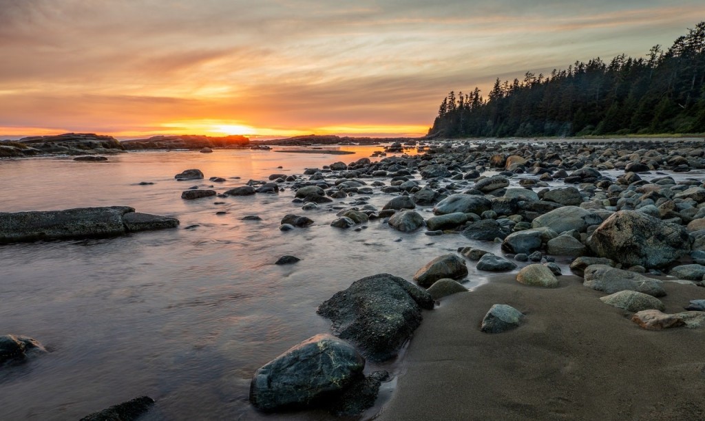 A rocky shore during sunset—a way to experience Vancouver like a local
